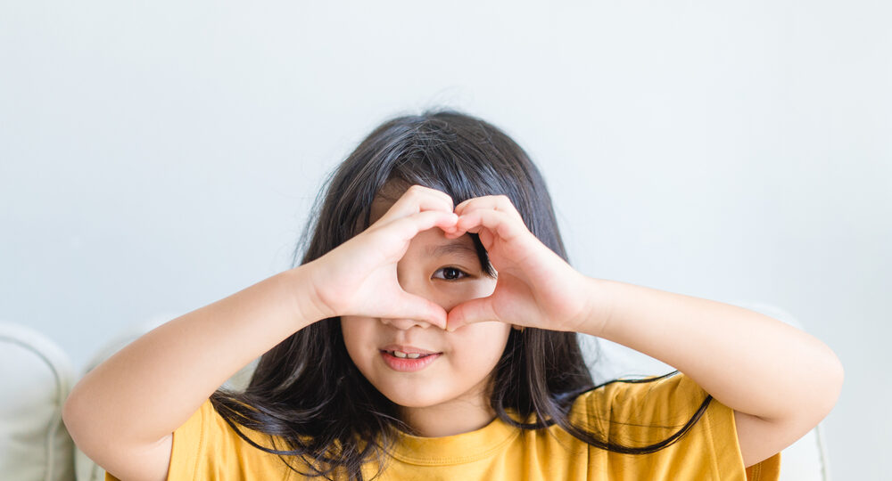 Healthy,Eyes,And,Vision.portrait,Happy,Asian,Kid,Child,Holding,Heart