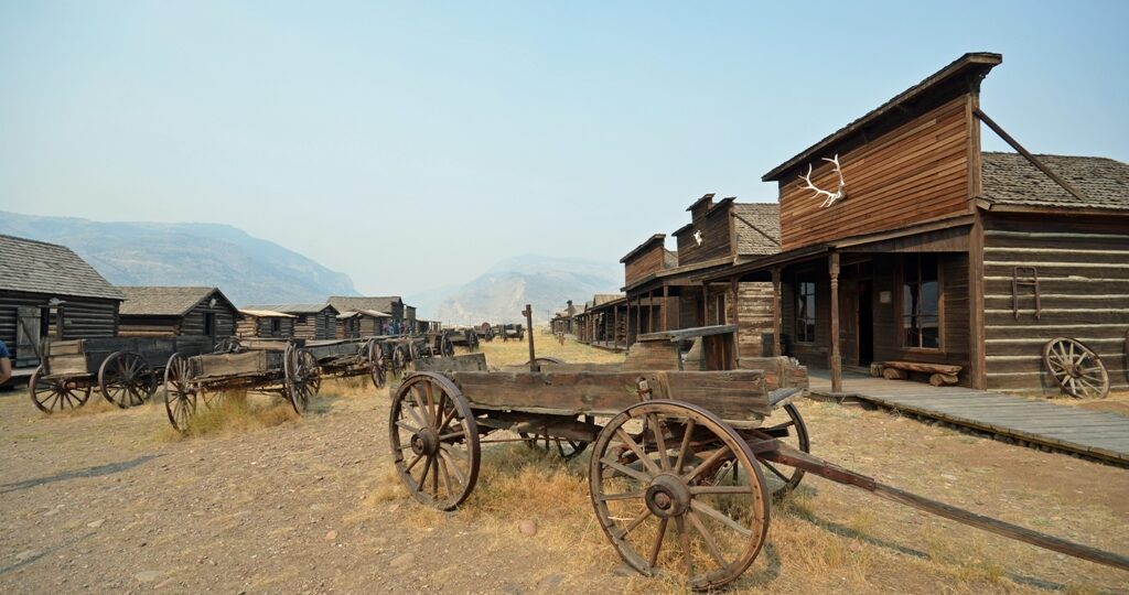 buildings and wagons in historic cowboy ghost town, Wyoming