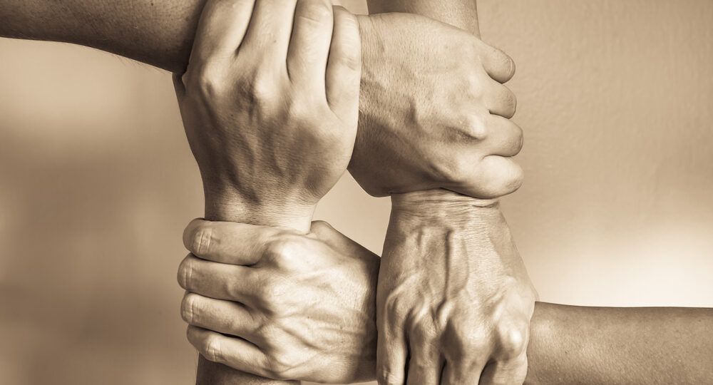 Hands,United,Helping,Each,Other.,In,Unity,There,Is,Strength
