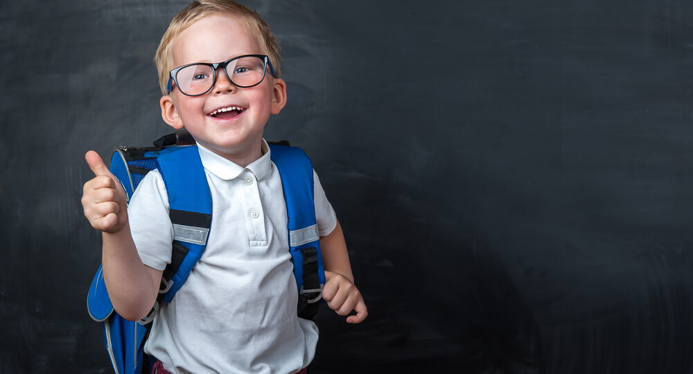 Happy,Smiling,Boy,In,Glasses,With,Thumb,Up,Is,Going