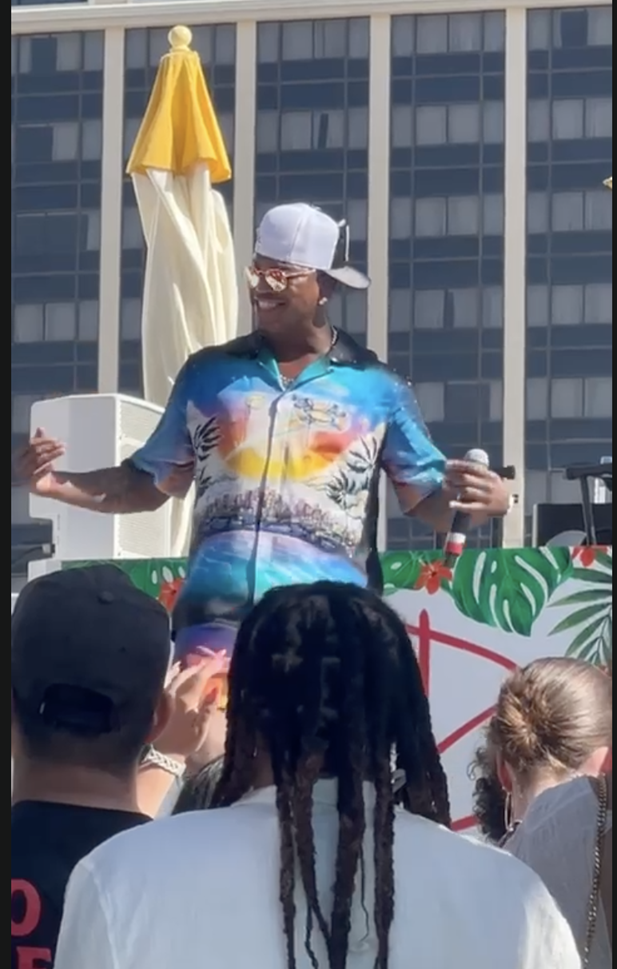 Ne-Yo performing at a pool party 